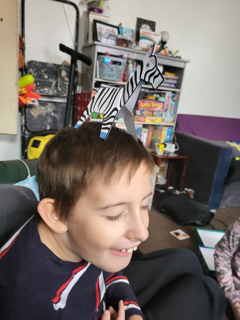 Warren with his 3d zebra on his head