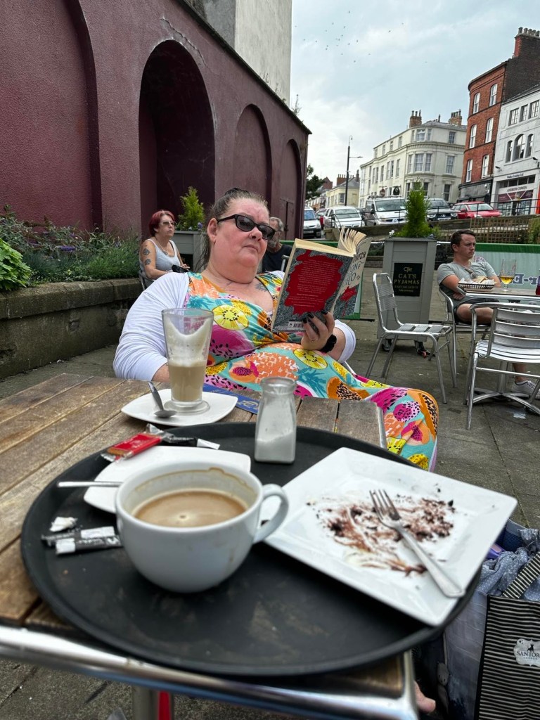 me reading a book in the cafe